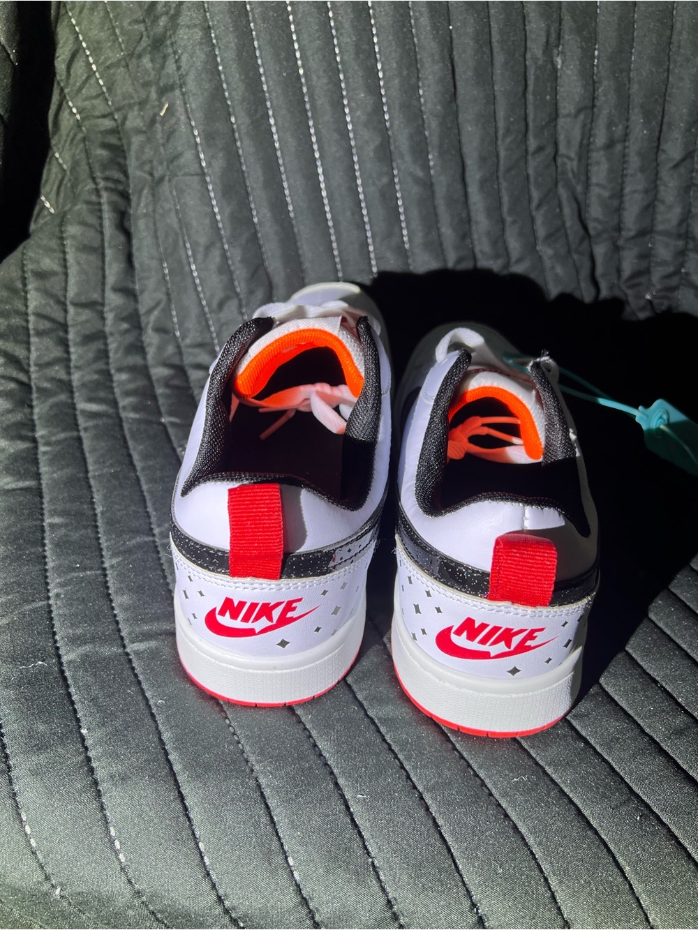 Nike White Low-Top Sneakers with Black Swoosh and Red Outsole - Picture 3 of 8